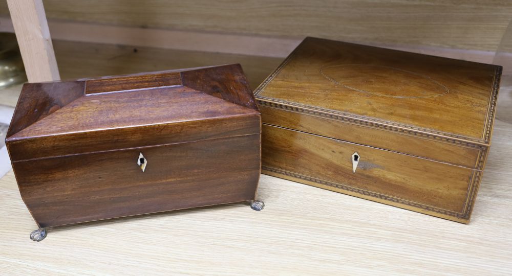 An early 19th century mahogany sarcophagus shape tea caddy with gilt metal mounts, 32cm, and a 19th century writing / work box, width 3